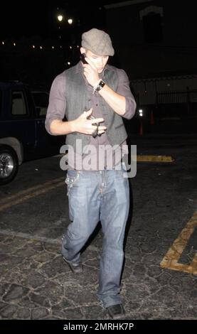 Hunky 'Twilight' and '90210' star Kellan Lutz chats on his cellphone as he leaves the nightclub Bardot in Los Angeles, CA. 11/24/08. Stock Photo