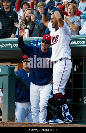 Toronto Blue Jays Paul Molitor, right, is greeted in the dugout as