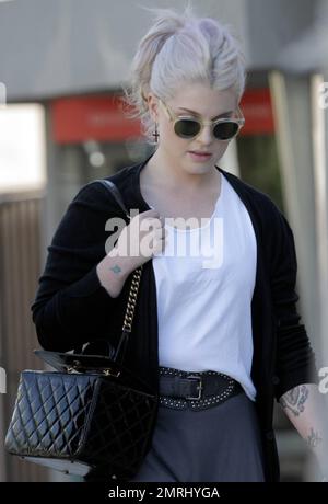 kelly osbourne smoking cigarette Wearing a black sweater, white t shirt and grey skirt, strolls with a male friend in West Hollywood. Recent reports say that Kelly slammed designer Jean Paul Gaultier for paying The Fun Trait Yellowstone's Kelly