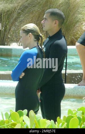 Exclusive!! US TV Show host Kelly Ripa spends a morning at the Miami Seaquarium with her family.  Ripa slipped into a wetsuit and filmed a segment of the show at Dolphin Harbor where the family swam with dolphins in The Dolphin Odyssey Experience.  After their fun at the Seaquarium the group headed over to Parrot Jungle Island.  Live with Regis and Kelly is filming live from Miami all week.  Miami, FL 5/2/09 Stock Photo