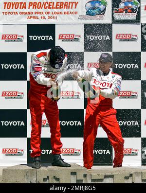 Japanese professional driver and drifter Ken Gushi and actor William  Fichtner celebrate their victories with a