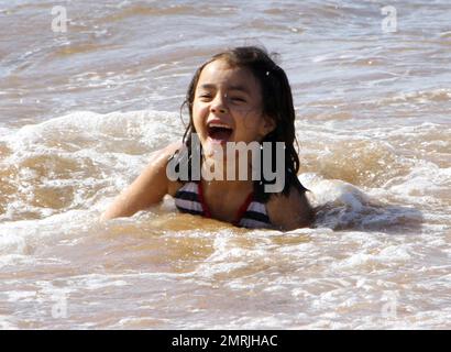 'Zookeeper' star Kevin James spends a day on the beach with his family while on holiday for Thanksgiving. James and his wife Steffiana de la Cruz spent the day on the beach with their daughter Sienna-Marie, 6, and newborn son Kannon Valentine, who was born on April 24 of this year. A proud dad, James carried around little Kannon who wore a hat to protect from the sun and later buried Sienna-Marie in the sand. Steffiana also took a surfside stroll with Sienna, who looked to have a great time swimming in the Pacific. Ever gracious, Kevin also took time to sign autographs and talk with some young Stock Photo