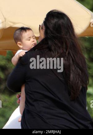 'Zookeeper' star Kevin James spends a day on the beach with his family while on holiday for Thanksgiving. James and his wife Steffiana de la Cruz spent the day on the beach with their daughter Sienna-Marie, 6, and newborn son Kannon Valentine, who was born on April 24 of this year. A proud dad, James carried around little Kannon who wore a hat to protect from the sun and later buried Sienna-Marie in the sand. Steffiana also took a surfside stroll with Sienna, who looked to have a great time swimming in the Pacific. Ever gracious, Kevin also took time to sign autographs and talk with some young Stock Photo