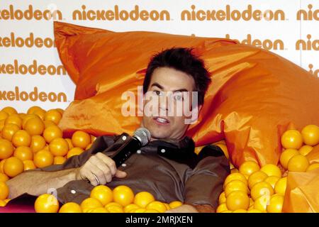 Host of Nickelodeon Australia's Kids Choice Awards 2010, US actor Jerry Trainor clowns around in a ball pit with Miss Singapore finalist Karen Wong prior to the event. Sydney, Australia. 10/8/10. Stock Photo