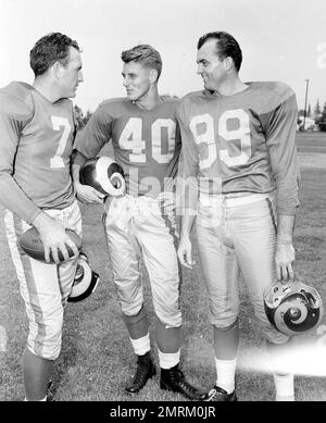 Coach Sid Gillman, left, who piloted he Los Angeles Rams to the Western  Division championship of the NFL in his rookie year, poses with two of his  star ends, Elroy Hirsch, center
