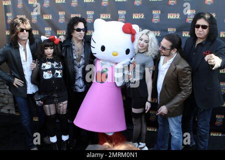 Paul Stanley poses with Hello Kitty at the KISS by Monster Mini