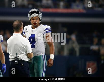 A New York Giants staff member wears an FDNY hat on the during