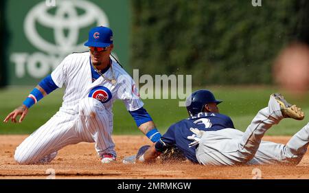 Chicago Cubs second baseman Javier Baez tags out Cleveland Indians  shortstop Francisco Lindor attempting to steal second base during the third  inning of game 1 of the World Series at Progressive Field