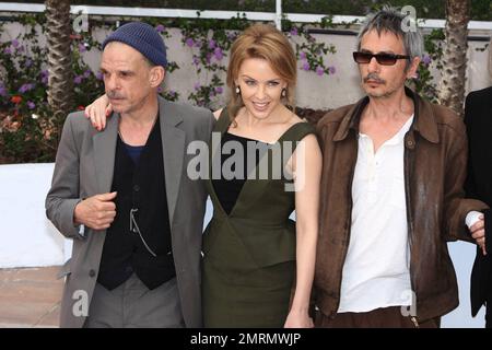 Denis Lavant, Kylie Minogue and director Leos Carax attend the 'Holy Motors' Photocall during the 65th Annual Cannes Film Festival at Palais des Festivals in Cannes, France. 23rd May 2012. Stock Photo