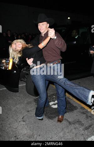 Jewel's husband and new 'Dancing with the Stars' contestant Ty Murray dances with a fan after arriving at the Star Magazine Lady Gaga concert at the nightclub Apple in Los Angeles, CA. 3/11/09. Stock Photo