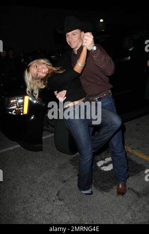 Jewel's husband and new 'Dancing with the Stars' contestant Ty Murray dances with a fan after arriving at the Star Magazine Lady Gaga concert at the nightclub Apple in Los Angeles, CA. 3/11/09. Stock Photo