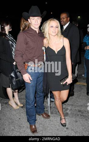 Jewel, using crutches to nurse an injury, arrives with husband and 'Dancing with the Stars' challenger Ty Murray at the Star Magazine Lady Gaga concert at the nightclub Apple in Los Angeles, CA. 3/11/09. Stock Photo