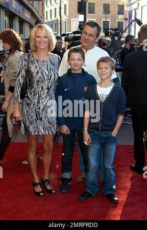 Gillian Taylforth and family pose for photographers on the red carpet at the UK premiere of Warner Bros. 'Legend of the Guardians: The Owls of Ga'Hoole' held at Odeon cinema in London's West End.  The adventure and fantasy animation, directed by Zack Snyder (Watchmen, 300), features the voices of Helen Mirren, Sam Neill, Jim Sturgess and Geoffrey Rush.  Based on a popular book series, the family film has been described as a children's version of 'Braveheart' with reviews saying it's, 'a dark and dense tale filled with noble warriors, mighty clashes and feathers flying' London, UK. 10/10/10. Stock Photo