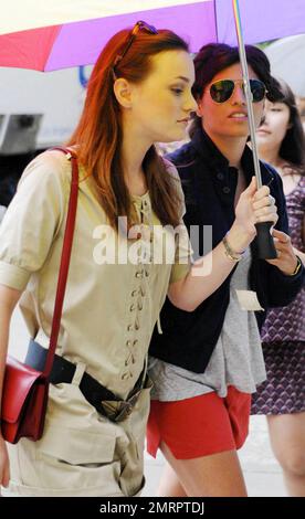 Actress Leighton Meester got a helping hand while on the set of 'Gossip Girl' filming in NYC.  As a light rain fell Meester, who wore a trendy tan jumper with gladiator sandals and a belt that accentuated her small waistline, had one of the crew hold an umbrella for her while walking with a bodyguard in between takes on the set of the hit CW teen drama TV series.  Co-star Jessica Szohr also walked with Meester at one point and wore large curlers in her hair. New York, NY. 07/13/10.   . Stock Photo