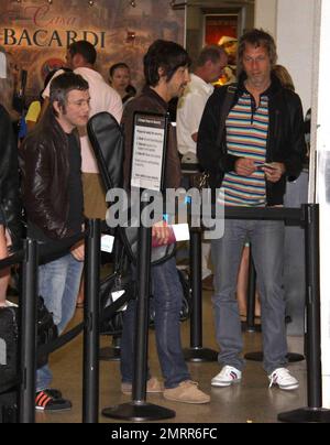 Exclusive!! Oasis Frontman Liam Gallagher looked Miami nice as he arrived at Miami airport channeling Sonny Crocket from Miami Vice. Liam was wearing a cream suit and animal print shoes as he took a flight to South America where Oasis are playing. Miami, Fl. 4/27/09. Stock Photo