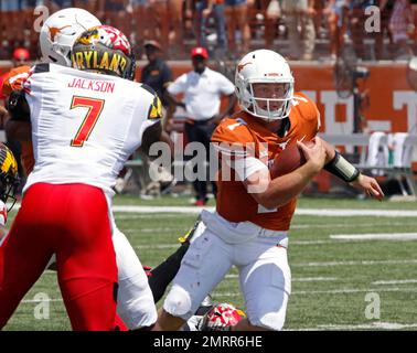 Texas quarterback Shane Buechele, right, runs the ball against Maryland  defensive back JC Jackson, left, during the second half of an NCAA college  football game, Sept. 2, 2017 in Austin, Texas. Maryland