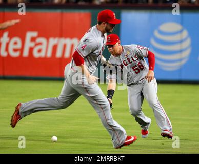 Texas Rangers right fielder Kole Calhoun throws during the second inning of  a spring training baseball game against the Seattle Mariners Monday, March  28, 2022, in Peoria, Ariz. (AP Photo/Charlie Riedel Stock