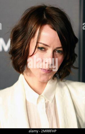 Wearing a sophisticated white blouse and white skirt suit Jena Malone poses for photographers on the red carpet at the premiere of 'Limitless' held at ArcLight Cinemas Cinerama Dome. Los Angeles, CA. 03/03/11. Stock Photo