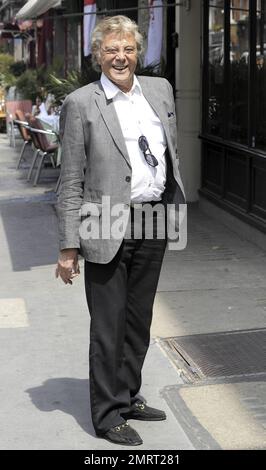 Lionel Blair takes a quick smoke break in the West End of London, UK. 6/23/10. . Stock Photo