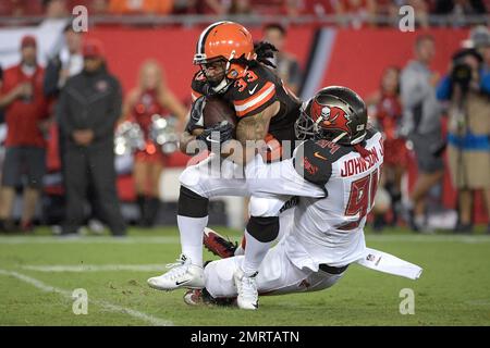 Cleveland Browns running back Terrence Magee (33) is stopped by