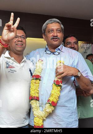 goa chief minister manohar parikkar right and health minister vishwajit rane showing victory sign both bharatiya janata party candidates pose for the media after they won the by polls to panaji and valpoi seats in panaji india monday aug 28 2017 ap photo 2mrtmh5