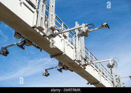 Close-up Of Security Camera On The Street. Multi-angle CCTV on pillar 360 degree system background blast cipping path operating over the road monitoring system of blue sky. Technology concept Stock Photo