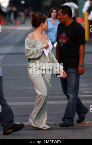 Jennifer Lopez continues filming on The Back-up Plan. Lopez was spotted wearing an off-the-shoulder top and matching sweat pants. San Fernando Valley, Ca. 6/17/09. Stock Photo