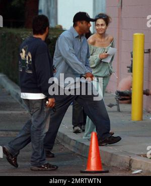 Jennifer Lopez continues filming on The Back-up Plan. Lopez was spotted wearing an off-the-shoulder top and matching sweat pants. San Fernando Valley, Ca. 6/17/09. Stock Photo