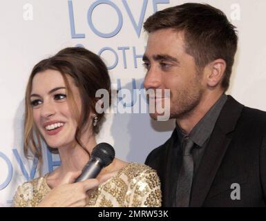 Co-stars Anne Hathaway and Jake Gyllenhaal have great chemistry on the red carpet at the premiere of 'Love & Other Drugs' held at Event Cinemas George Street.  The pair affectionately touched and hugged while laughing during an interview with Australian radio and TV personality Lizzy Lovette.  Gyllenhaal, who is reportedly dating young country pop singer Taylor Swift, was very relaxed and animated as he spoke with Lizzy. Sydney, AUS. 12/06/10. Stock Photo