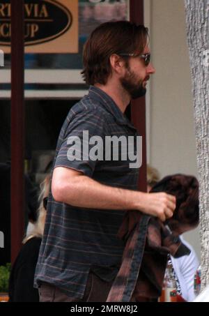 Actor Luke Wilson shows off his beard as he has a casual lunch with friends at Malibu Country Mart.  Later Wilson gets a bit shy and tries to hide his face from photographers. Los Angeles, CA. 07/03/10. Stock Photo