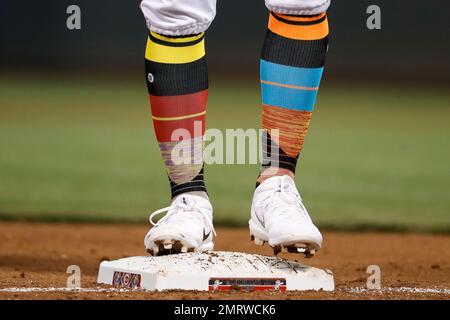 Cincinnati Reds' Eugenio Suarez (7) stands on third base with a triple as  Pittsburgh Pirates third baseman Sean Rodriguez, right, holds the late tag  during the eleventh inning of a baseball game