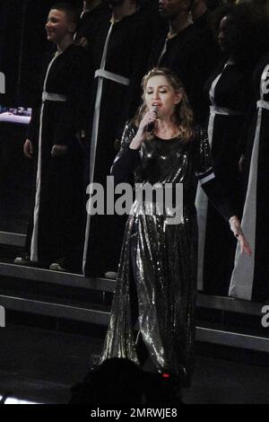 Madonna dances with son Rocco on stage during her MDNA Tour performance at the Staples Center. Rocco also appeared in a background choir wearing a choir robe during the performance. Los Angeles, CA. 10th October 2012. Stock Photo