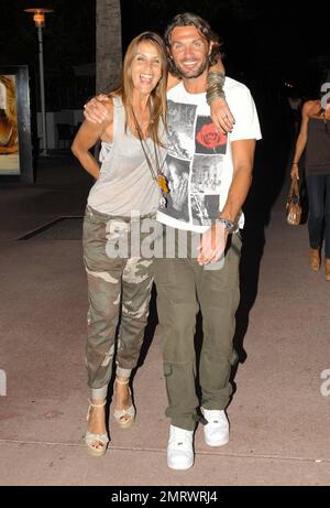 EXCLUSIVE!! Italian footballer Paolo Maldini and wife Adriana Maldini happily pose for photographers while out for an evening with fellow footballer Alessandro Nesta and his wife Gabriela Pagnozzi on Lincoln Rd. Miami Beach, FL.  07/09/10.   . Stock Photo