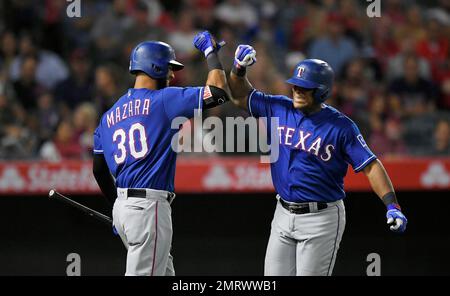 24 MAY 2016: Texas Rangers right fielder Nomar Mazara #30 gets  congratulated by Adrian Beltre after hitting a home run during the MLB game  between the Los Angeles Angels and Texas Rangers