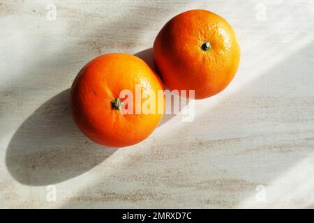 Ripe oranges on table Stock Photo