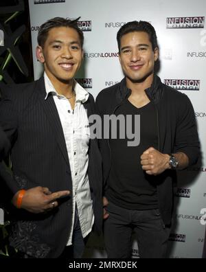 EXCLUSIVE!! 'Extra' host Mario Lopez poses for photos with fans during an appearance at Infusion nightclub's VIP Lounge. San Francisco, CA. 10/23/10. Stock Photo