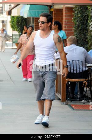 Exclusive!! Mark Wahlberg leaves a coffee shop in Beverly Hills. Mark is reportedly finally considering tying the knot with longtime girlfriend Rhea Durham after she gives birth to their third child in September. But, with his brother Donnie Wahlberg filing for divorce  from his wife of nine years, Kim Fey, on August 13, will Marky Mark get cold feet? Los Angeles, CA. 8/27/08. Stock Photo