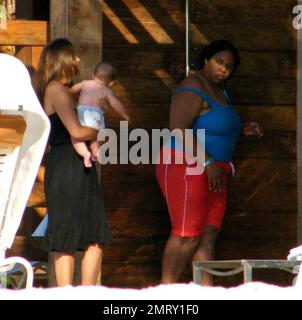 Exclusive!! Actor Matt Damon takes his family on vacation for Valentines weekend to an exclusive resort in the Caribbean.  Damon took time out to play with daughter Alexia and Isabella whilst wife Luciana kept baby Gia Zavala in the shade.  Hard-working Damon also kicked back whilst soaking up the sun and enjoying a few cocktails. The family's fun was put to an abrubt end with a surprise thunderstorm that sent him and family running back to their hotel covered in towels to hide from the rain. Caribbean. 2/15/09. Stock Photo