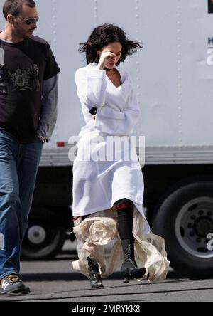 Exclusive!! Megan Fox films on location in Sylmar, CA this morning.  She was seen walking to the set with a white robe covering a frilly cowboy-western style dress, complete with boots and garter.  Fox plays Leila in the upcoming western movie, 'Jonah Hex,' also starring Josh Brolin.  Los Angeles, CA. 4/3/09. Stock Photo