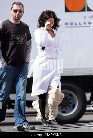 Exclusive!! Megan Fox films on location in Sylmar, CA this morning.  She was seen walking to the set with a white robe covering a frilly cowboy-western style dress, complete with boots and garter.  Fox plays Leila in the upcoming western movie, 'Jonah Hex,' also starring Josh Brolin.  Los Angeles, CA. 4/3/09. Stock Photo