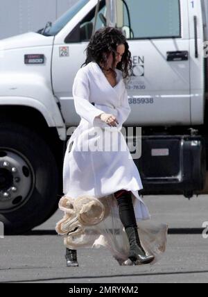 Exclusive!! Megan Fox films on location in Sylmar, CA this morning.  She was seen walking to the set with a white robe covering a frilly cowboy-western style dress, complete with boots and garter.  Fox plays Leila in the upcoming western movie, 'Jonah Hex,' also starring Josh Brolin.  Los Angeles, CA. 4/3/09.     .  . Stock Photo