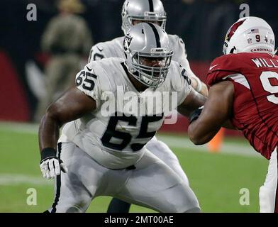 Oakland Raiders offensive guard Jordan Devey (65), center Richie Incognito ( 64), and offensive …