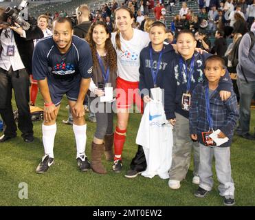 Donald Faison and Brandi Chastain take part in a celebrity soccer game to raise funds for the Mia Hamm Foundation which supports patients and their families who benefit from bone marrow transplants. The event was hosted by Mia Hamm and Nomar Garciaparra. Los Angeles, CA. 1/16/10.     . Stock Photo