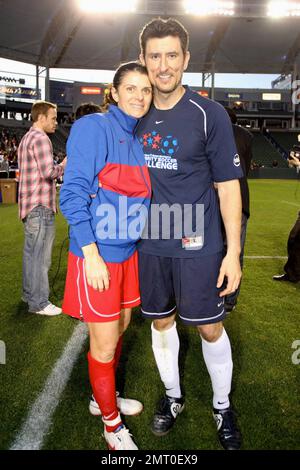 Mia Hamm and Nomar Garciaparra take part in a celebrity soccer game to raise funds for the Mia Hamm Foundation which supports patients and their families who benefit from bone marrow transplants. The event was hosted by Mia Hamm and Nomar Garciaparra. Los Angeles, CA. 1/16/10.   . Stock Photo