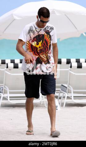 Amid reports that his career with the German national soccer team may be over, Michael Ballack looks solemn, but still manages to flash a few smiles while spending a day on the beach with friends. According to reports, Germany coach Joachim Loew will decide Ballack's fate after his holiday and three international games for which he was not chosen. Loew said, 'He will go on holiday for a few days. We have decided to go into the final three games of the season with a successful team and then hold final talks.' Ballack, who will turn 35 in September, hasn't played for the team since injuring his Stock Photo