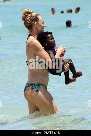 Jillian Michaels and her daughter, Lukensia enjoy the surf on Miami Beach  during Veteren's Day Featuring