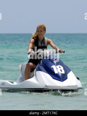 Swiss TV host and actress Michelle Hunziker spends an afternoon jetskiing with boyfriend Tomaso Trussardi during a visit to Miami Beach, FL. 4th June 2012. Stock Photo