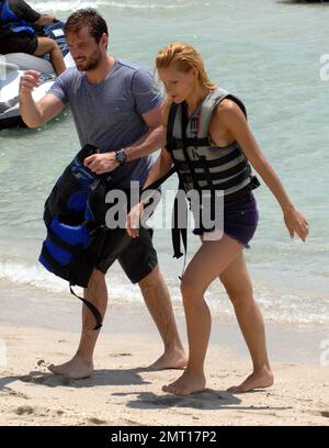 Swiss TV host and actress Michelle Hunziker spends an afternoon jetskiing with boyfriend Tomaso Trussardi during a visit to Miami Beach, FL. 4th June 2012. . Stock Photo
