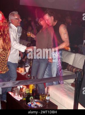 Exclusive!! Sin City star Mickey Rourke gets up close and personal with an  un-identified female at a hot Miami Beach nightclub. Note the ring on the  third finger of the girl's left hand. 1/27/07 All Stock Photo - Alamy