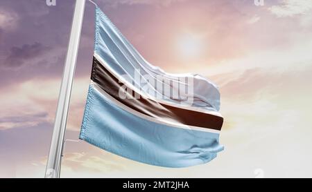 Botswana waving flag in beautiful sky. Stock Photo